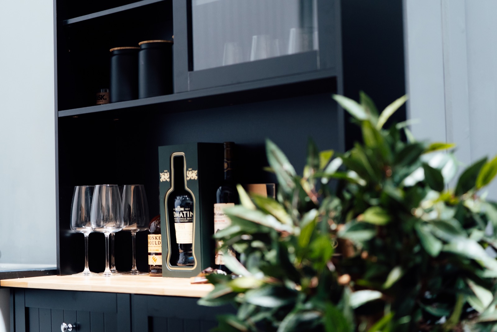 Drinks cabinet with glasses and whisky