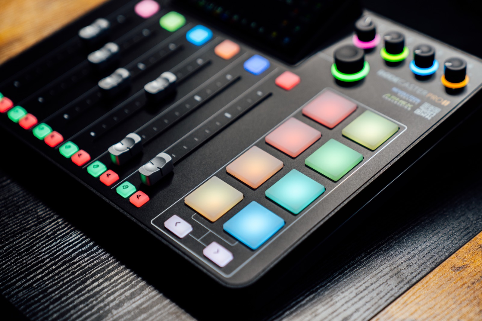 RØDECaster Pro II mixer with lit pads and faders